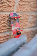 Mckenzie - Red Abstract Split Ply Fingerboard Deck (34mm - Mid Shape) - Skull Fingerboards
